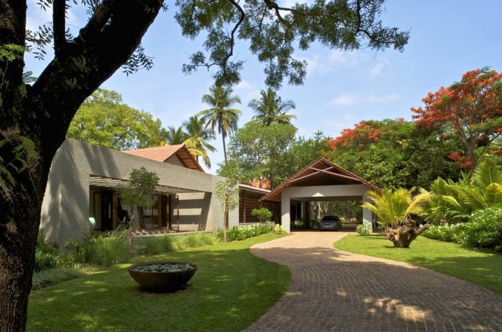 house surrounded by trees to keep it cool in summer