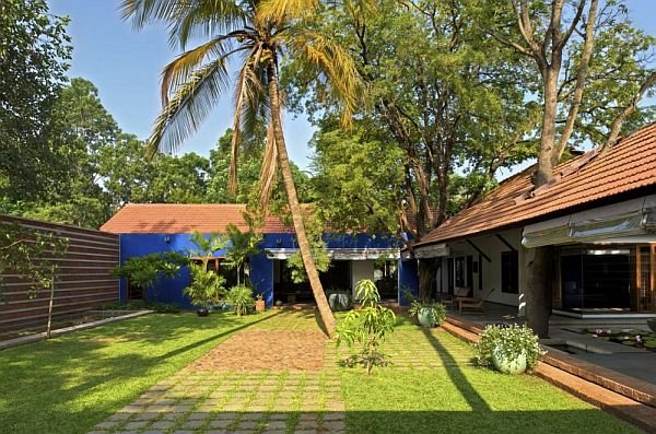 traditional indian house surrounded by trees